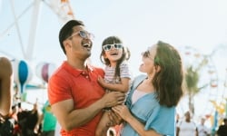 A close up view of a family laughing and enjoying their time at the Santa Monica Pier