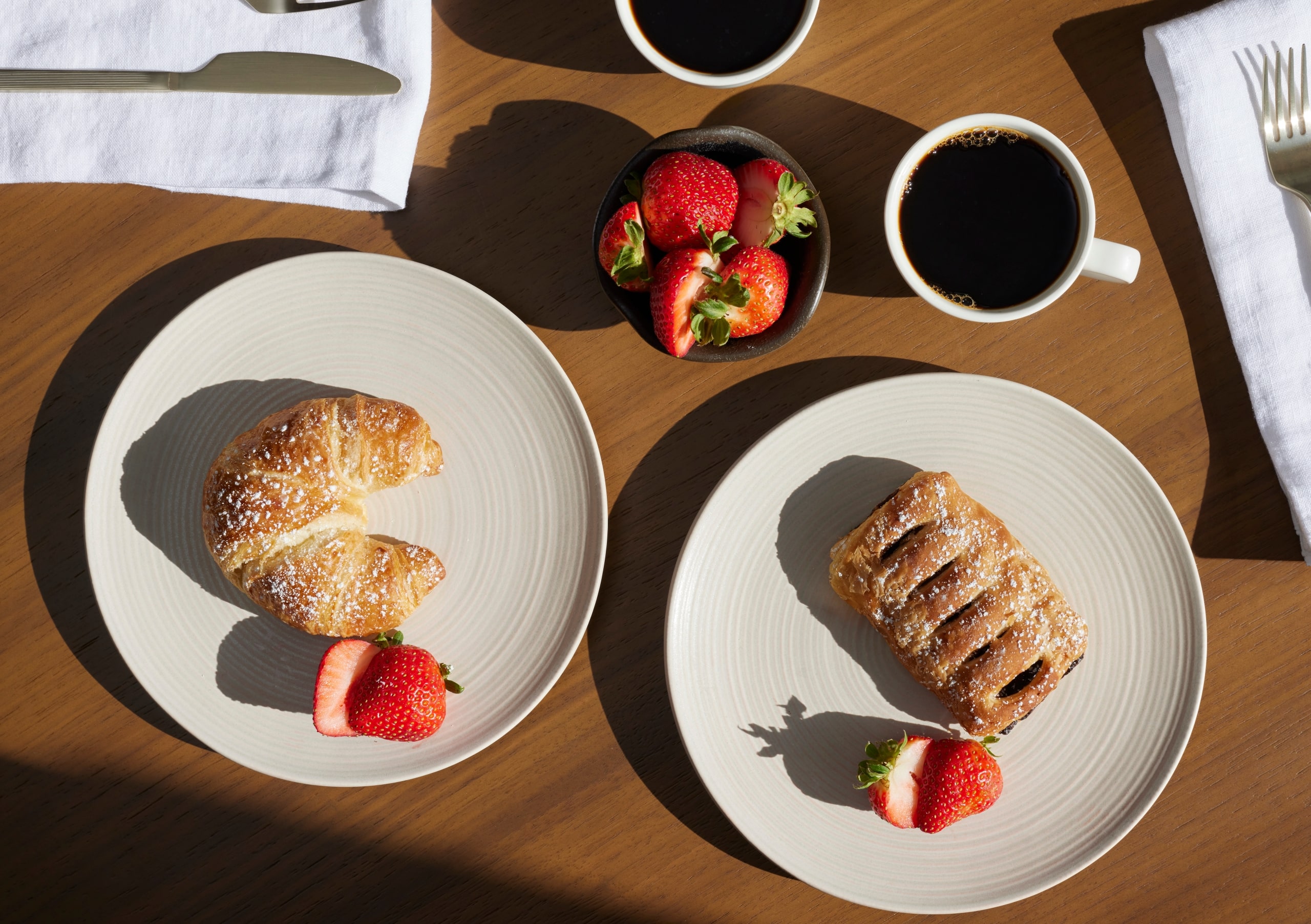 Baked goods with fruit and coffee