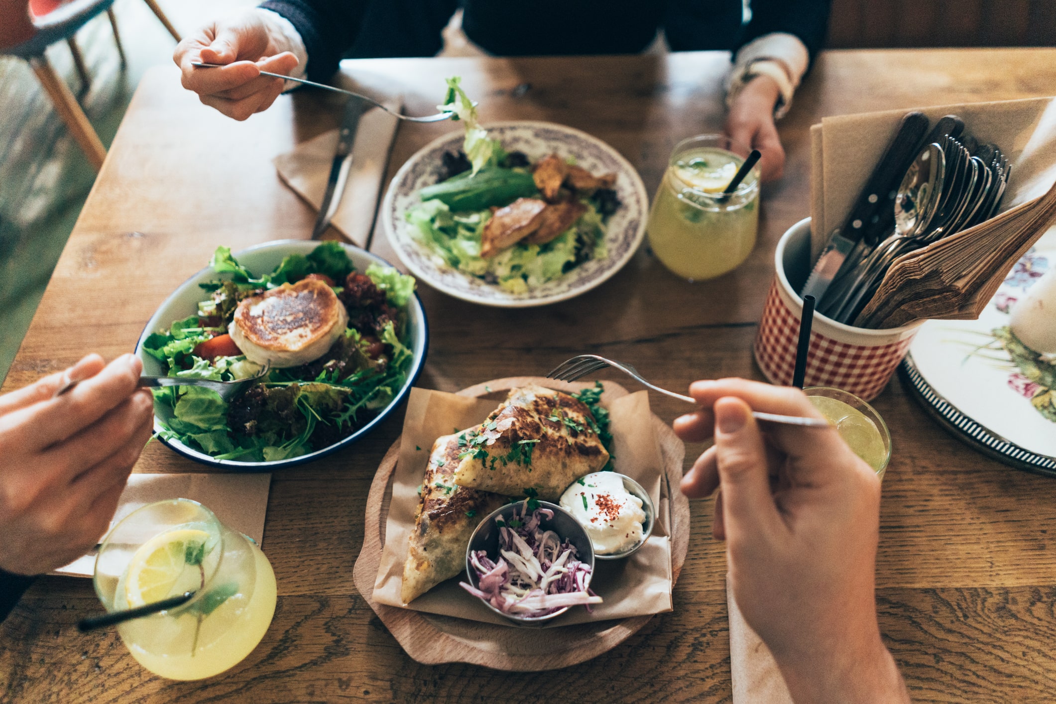 People enjoying their plates of freshly made food at Rustic Canyon